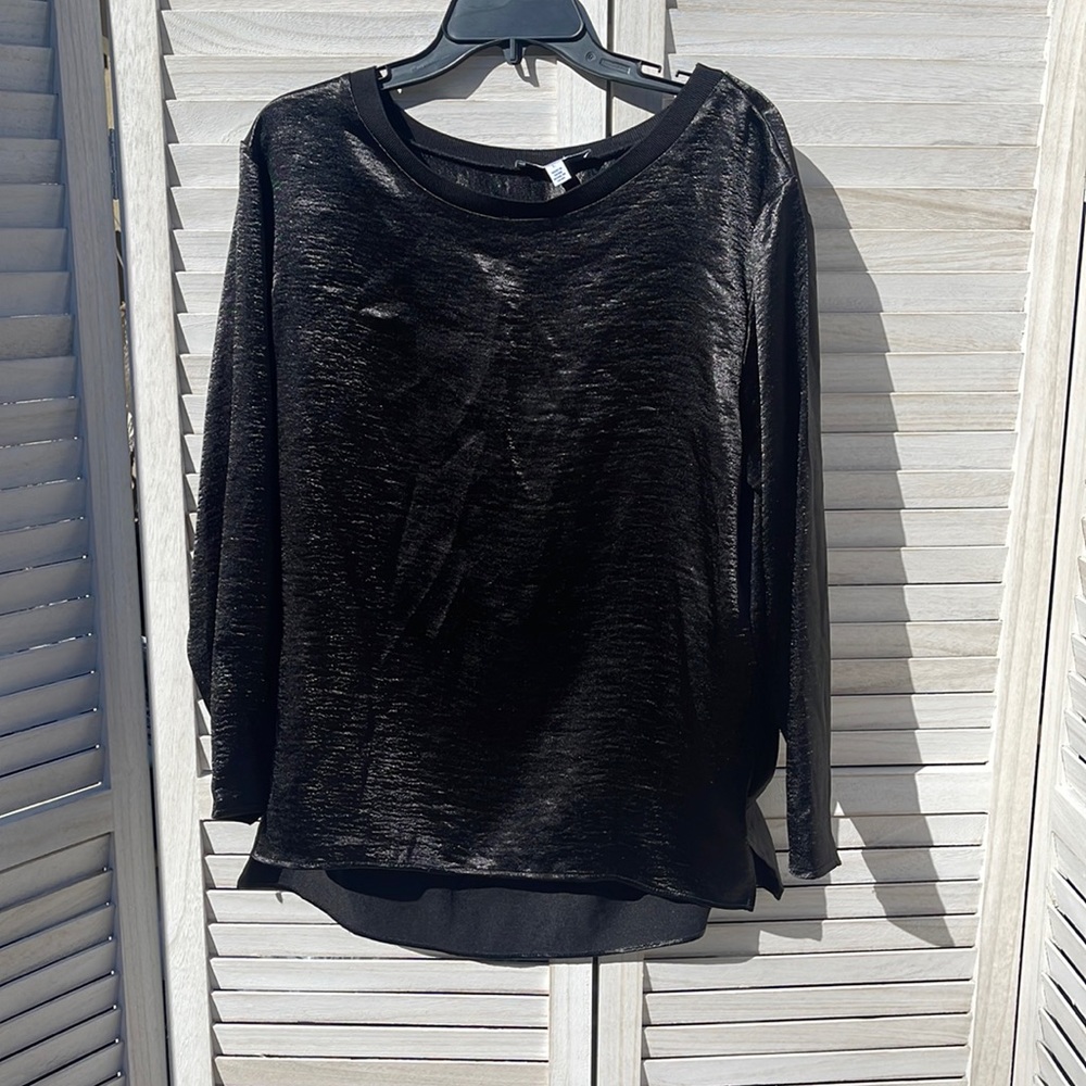 Black shiny blouse.